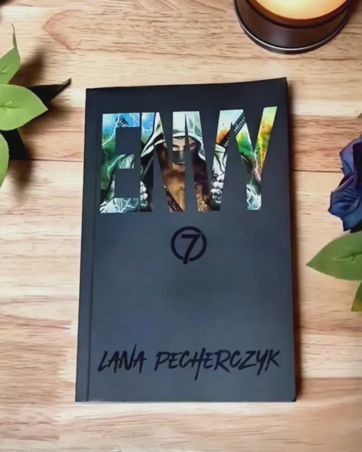 A video of a person looking through the special edition copy of the Envy book